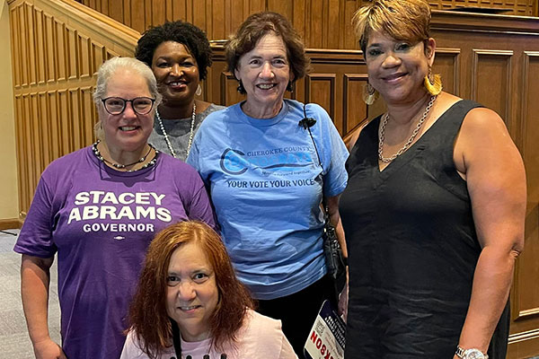 Four Cherokee volunteers with Stacey Abrams