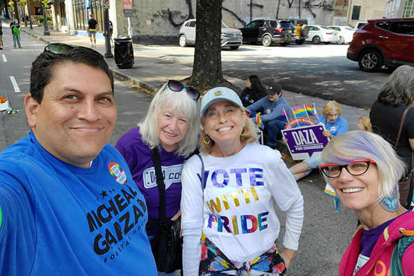 Cherokee volunteers with candidate Micheal Garza at the Pride parade